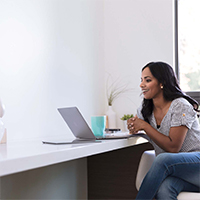 Woman working from home with 9Line protection